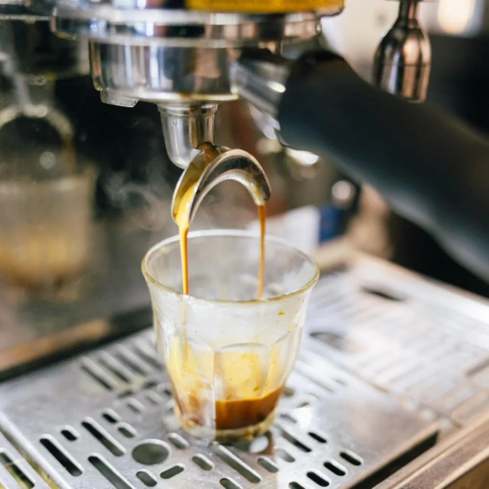 Espresso machine pouring a shot.